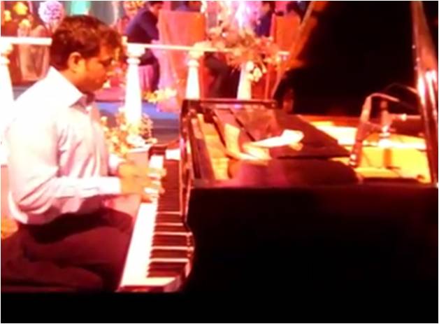 male piano player belgaum